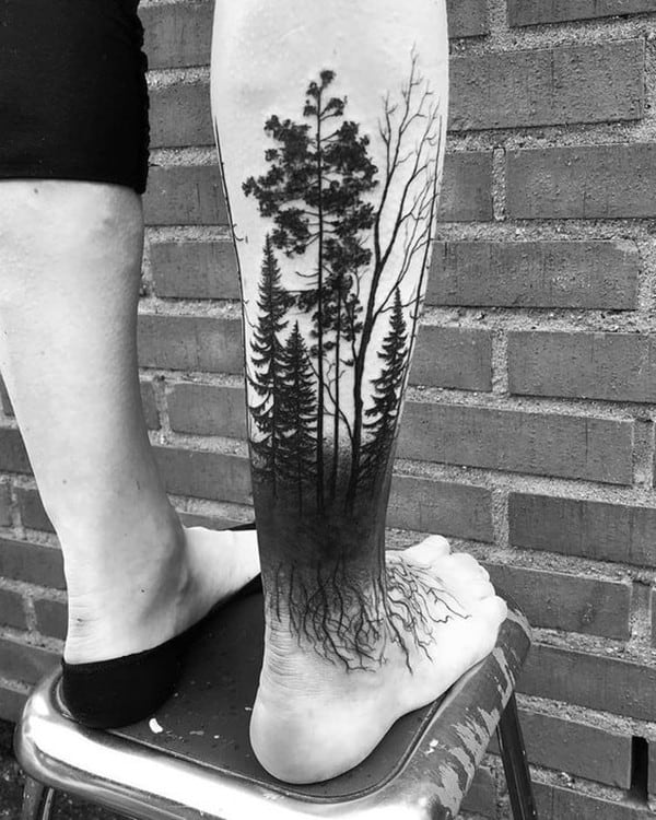 forest tattoo in leg